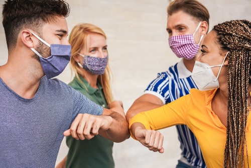 Nonprofit team members wearing face masks and smiling